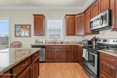 Welcome to refined coastal living in this custom-built - photo 14