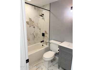 Beautifully remodeled concrete block 4/2 home with a new metal - photo 24