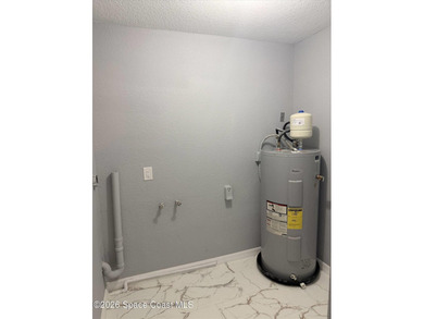 Beautifully remodeled concrete block 4/2 home with a new metal - photo 26
