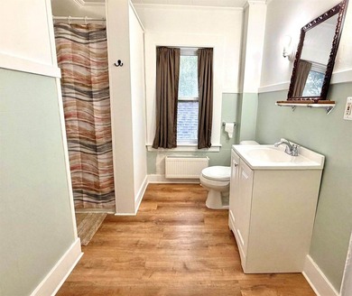 Step into this cozy 2-bedroom, 1.5-bath New Englander, where - photo 16