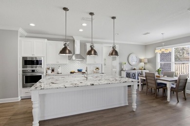 Welcome to this beautifully maintained home in the highly - photo 1