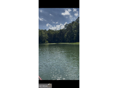 Beautiful wooded lot gently slopes toward Corp frontage - photo 2