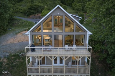 Perched above the crystal-clear waters of Watauga Lake, this - photo 1