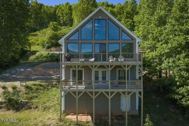 Perched above the crystal-clear waters of Watauga Lake, this - photo 4