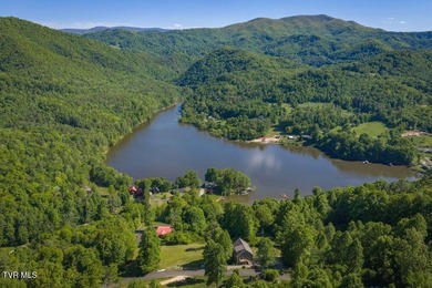 Perched above the crystal-clear waters of Watauga Lake, this - photo 5