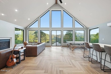 Perched above the crystal-clear waters of Watauga Lake, this - photo 10