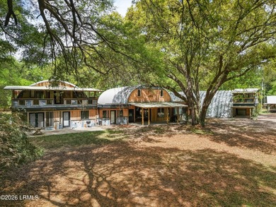 Tucked away down a quiet dirt road on 4.83 private acres on - photo 1