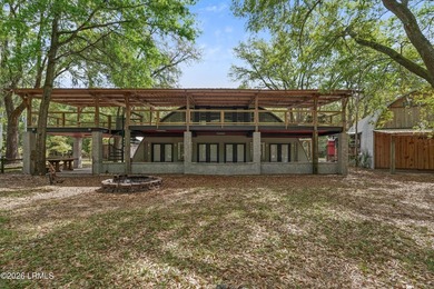 Tucked away down a quiet dirt road on 4.83 private acres on - photo 3