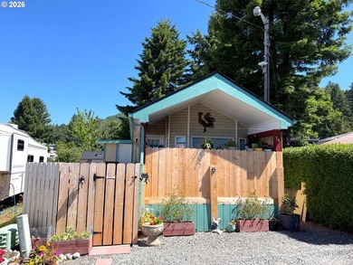 Updated 2004 park model located in the 55+ Chetco RV Park. This - photo 2