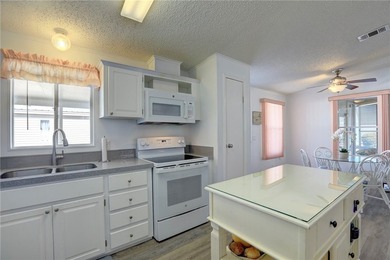 This beautifully maintained home features an open floor plan and - photo 8