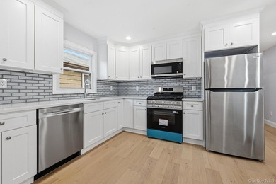 Beutifully Renovated 2 Family High Ranch, 6 Bedrooms, 4 Full - photo 16