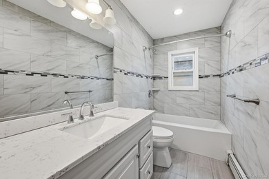 Beutifully Renovated 2 Family High Ranch, 6 Bedrooms, 4 Full - photo 17