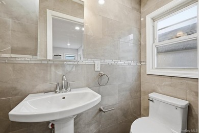 Beutifully Renovated 2 Family High Ranch, 6 Bedrooms, 4 Full - photo 24