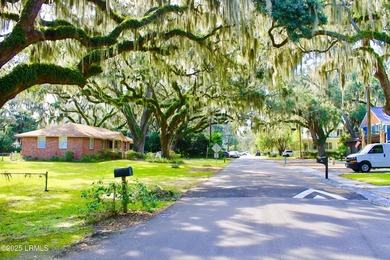 Tucked beneath a canopy of moss-draped live oaks, this home in - photo 7