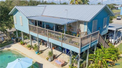 Welcome to this exceptional 2,488 sq ft two-story coastal home