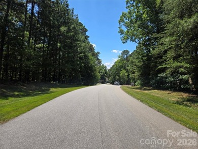 This Badin Lake area lot is located in the prestigious gated - photo 9
