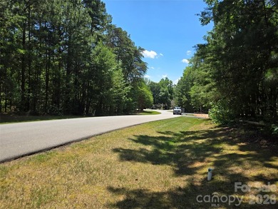 This Badin Lake area lot is located in the prestigious gated - photo 10