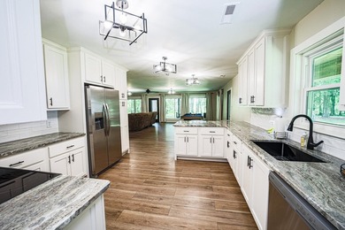 Completely gutted and beautifully remodeled, this waterfront - photo 22