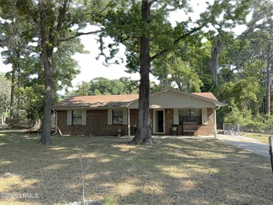 Charming 3-bedroom, 1.5-bath brick home situated on nearly half - photo 1