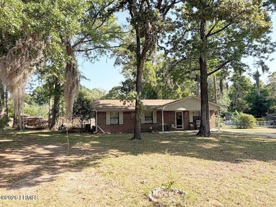 Charming 3-bedroom, 1.5-bath brick home situated on nearly half - photo 2