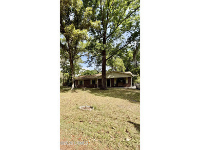 Charming 3-bedroom, 1.5-bath brick home situated on nearly half - photo 3