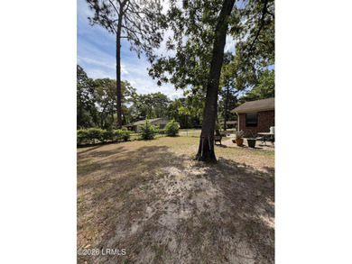 Charming 3-bedroom, 1.5-bath brick home situated on nearly half - photo 5