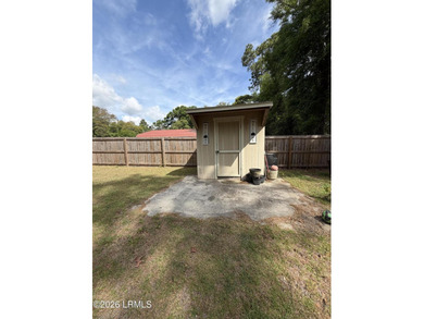 Charming 3-bedroom, 1.5-bath brick home situated on nearly half - photo 6