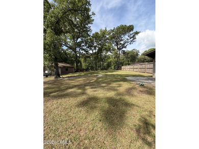 Charming 3-bedroom, 1.5-bath brick home situated on nearly half - photo 7