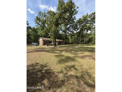 Charming 3-bedroom, 1.5-bath brick home situated on nearly half - photo 8