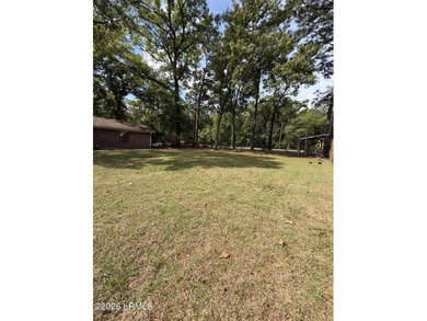 Charming 3-bedroom, 1.5-bath brick home situated on nearly half - photo 10