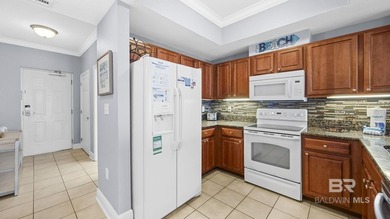 Set on the 18th floor, this 2-bedroom, 2-bath residence offers a - photo 4
