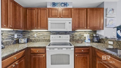 Set on the 18th floor, this 2-bedroom, 2-bath residence offers a - photo 5