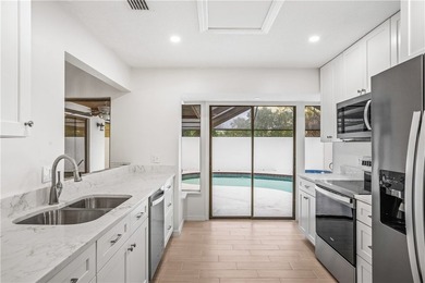 Sophistication meets the shoreline in this renovated modern pool - photo 3