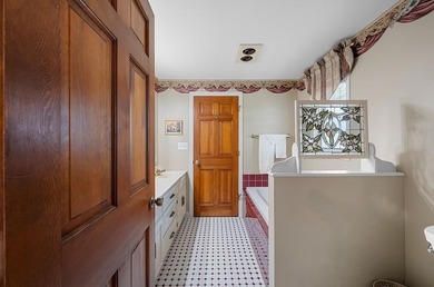 Beautiful arched-window entry welcomes you to this inviting lake - photo 38