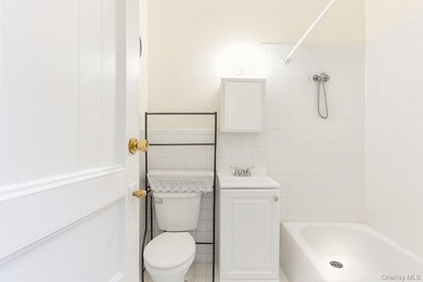 Exceptional brownstone six-unit multi-family building offering a - photo 13