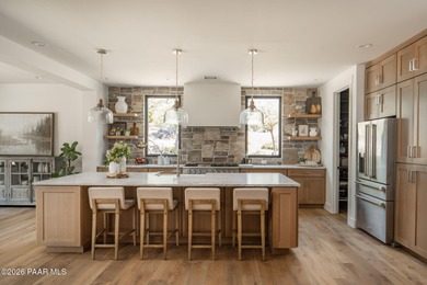 Stunning single level custom home on almost an acre in town!