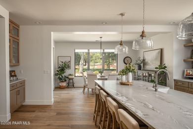 Stunning single level custom home on almost an acre in town!