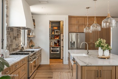 Stunning single level custom home on almost an acre in town!