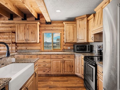 Custom log home nestled at the end of a quiet Cul-de-sac on two - photo 16
