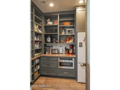 Stunning single level custom home on almost an acre in town!