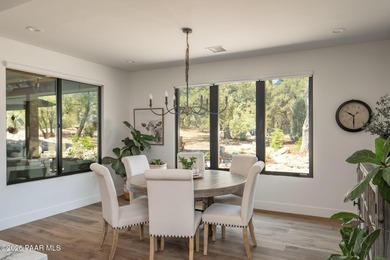 Stunning single level custom home on almost an acre in town!