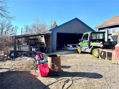 This property is a hunter and mechanic's dream. Eight acres of