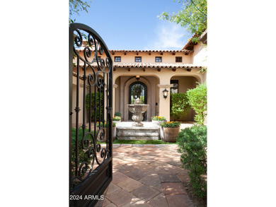 This timeless styled Spanish Colonial home rests in guard gated - photo 3