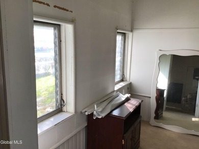 This family-owned two-family home has never been rented. First - photo 11