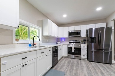 This beautifully updated 4-bedroom, 1.5-bath home offers the - photo 11