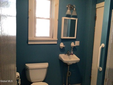 This family-owned two-family home has never been rented. First - photo 14