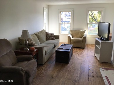 This family-owned two-family home has never been rented. First - photo 15