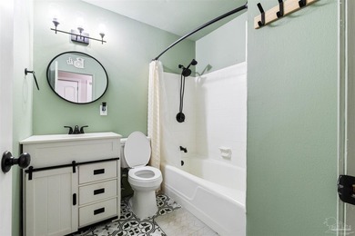 This beautifully updated 4-bedroom, 1.5-bath home offers the - photo 16