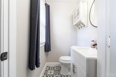 This beautifully updated 4-bedroom, 1.5-bath home offers the - photo 18