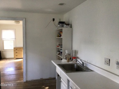 This family-owned two-family home has never been rented. First - photo 19